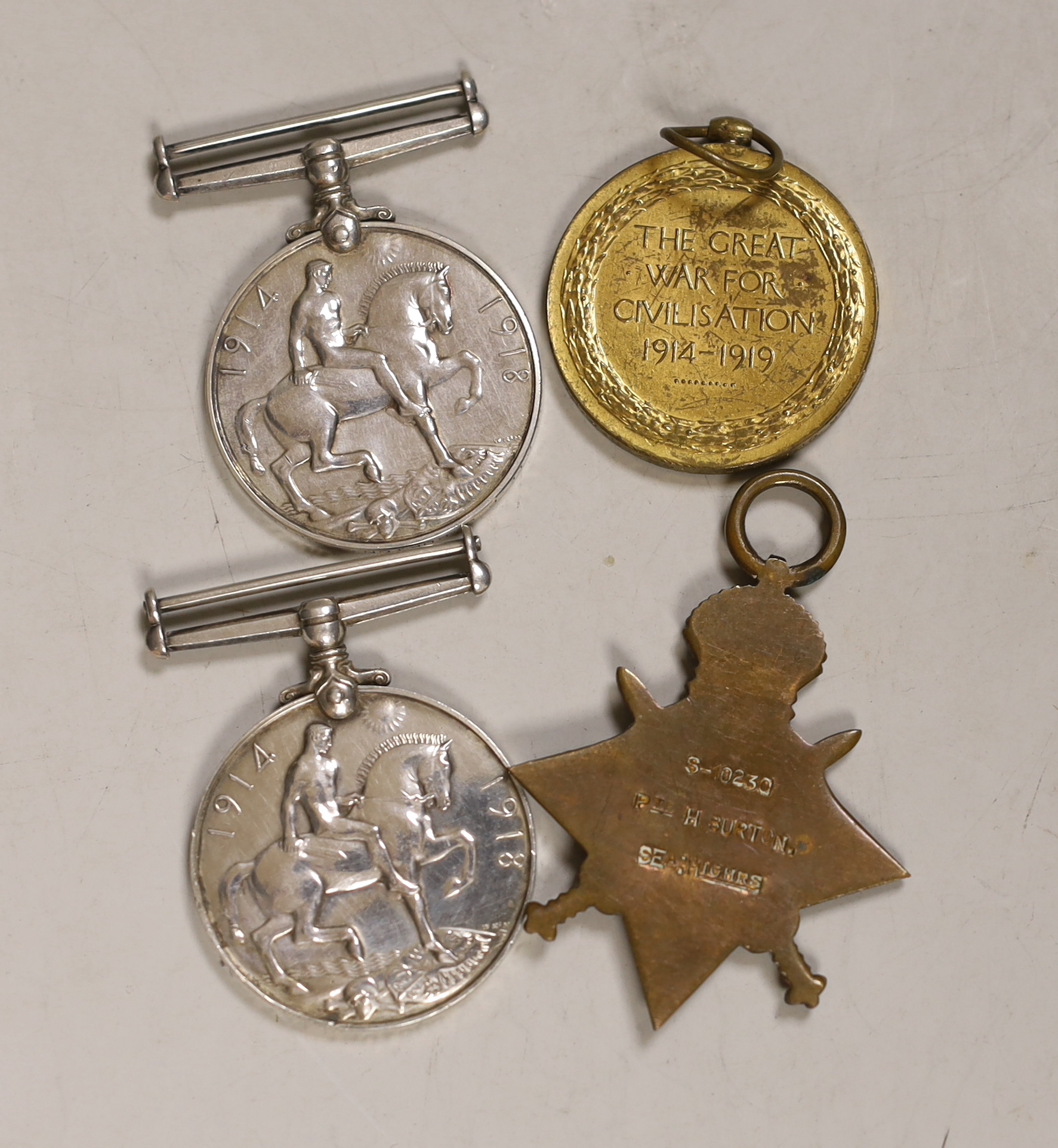 WWI medal group trio awarded to Corporal Henry Burton, 2nd Bn. Seaforth Highlanders and a WWI War Medal awarded to Private Percy John Burton, 6th Bn. Northamptonshire Regiment